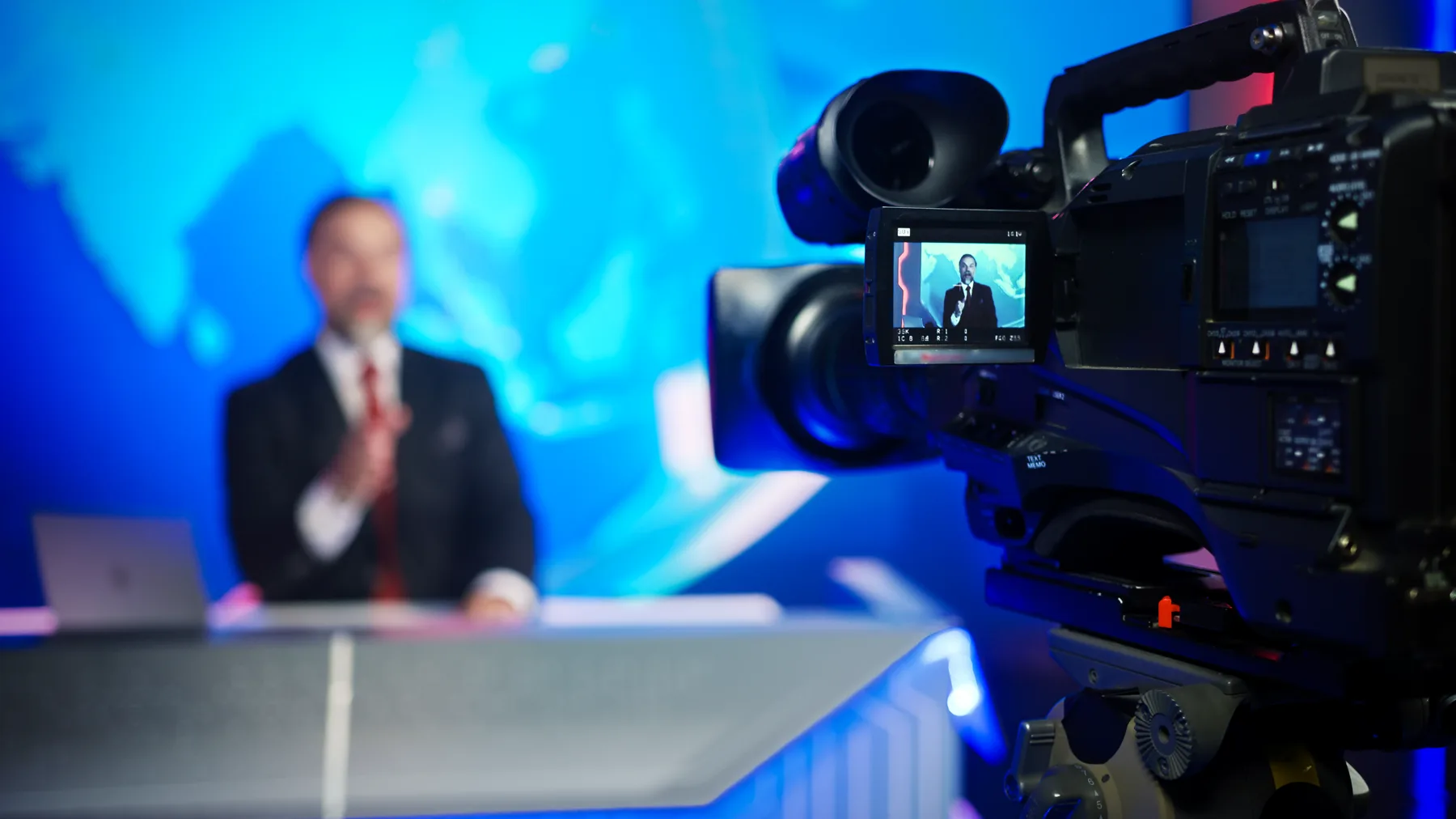 A camera trained on a presenter in a small studio