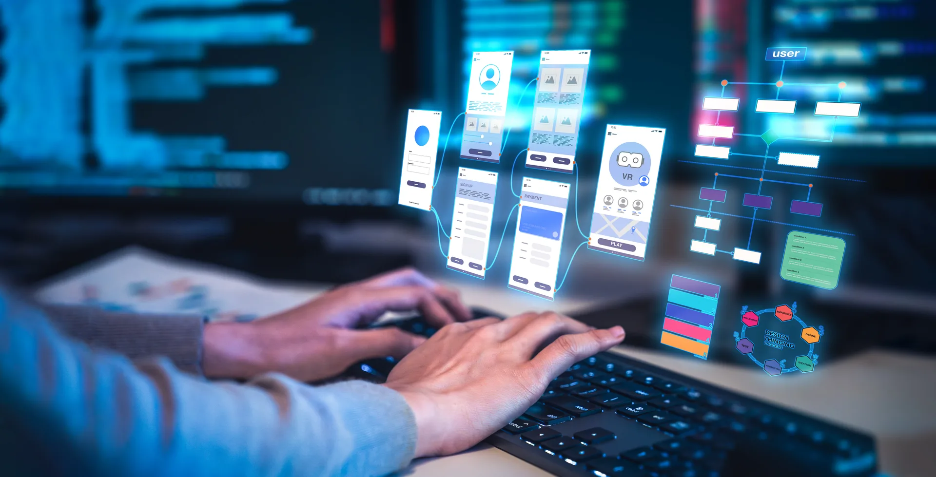 Hands at a keyboard beneath a set of mobile interface panels